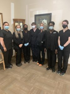 the eye site team wearing masks