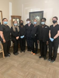 the eye site team wearing masks